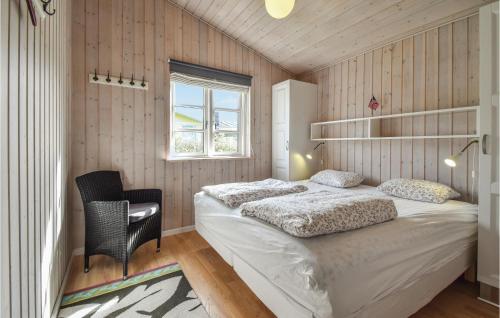 a bedroom with a bed and a desk and a window at 3 Bedroom Cozy Home In Martofte in Martofte