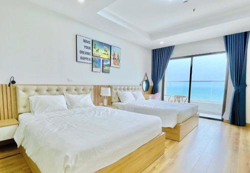 TMS Beachfront Quy Nhon Apartmentにあるベッド