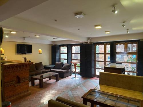 a living room with a couch and a fireplace at Hotel vintage Home in Bhaktapur