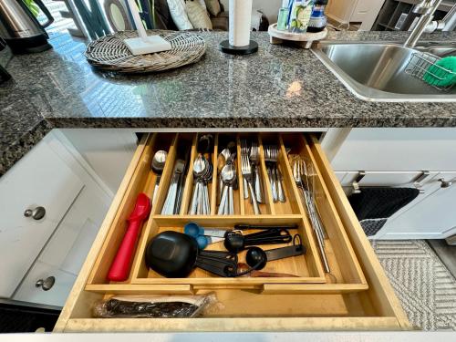 a drawer filled with utensils in a kitchen at Superb Home 7 minutes from Lackland Air Force Base in San Antonio