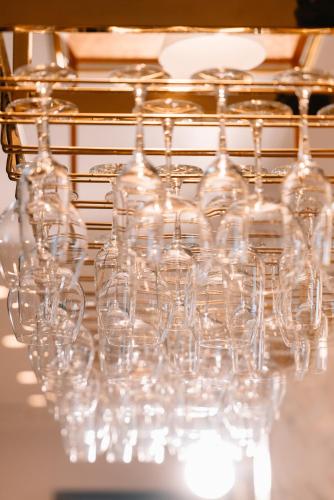 a bunch of wine glasses sitting on a table at Diamond Hotel in Hai Phong