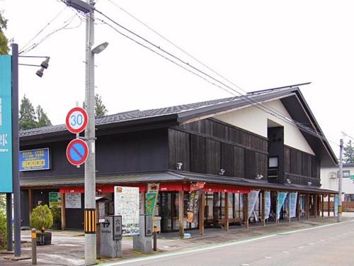 a building on the side of a street at Attakayama Onsen in Rokugō