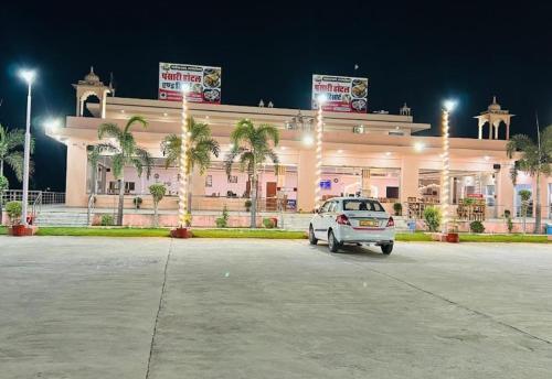 a car parked in front of a building at night at PANSARI HOTEL & RESORT in Dhāni Bhābhru