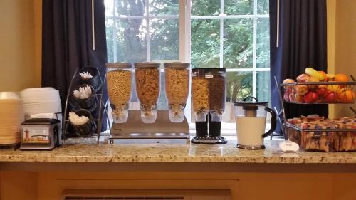 a counter top with a group of three food processors at Microtel Inn & Suites - Kearney in Kearney