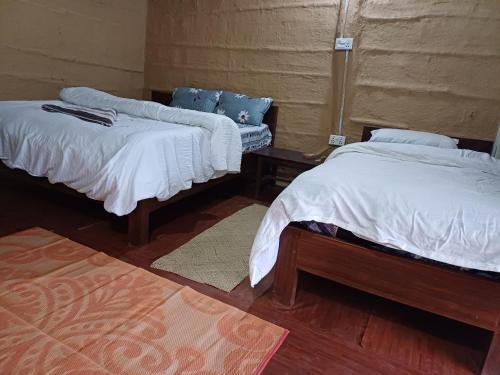 Postel nebo postele na pokoji v ubytování Bardiya Eco Safary Homestay