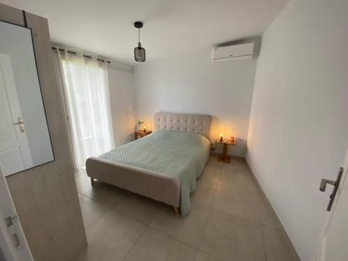 Ένα ή περισσότερα κρεβάτια σε δωμάτιο στο Bienvenue à Lakaz Titi