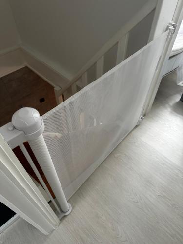 a white bed frame in a room with at Bos-Chalet bij Wijers Wandelroutes, Rust & Gezinsplezier Fijnspar 108 Hengelhoef in Houthalen-Helchteren