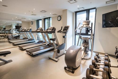 a gym with a bunch of treadmills and machines at Travelodge Myeongdong Euljiro in Seoul