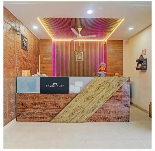a lobby of a hotel with a reception counter at PRAVI INN in Gomti Nagar