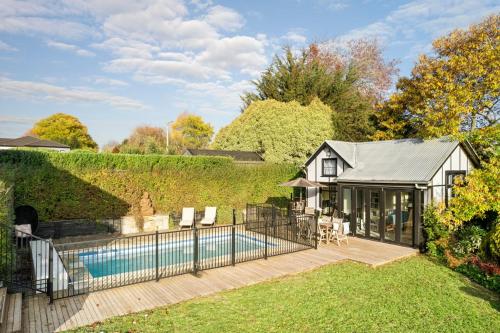 a house with a swimming pool in a yard at Queensberry Hill View- luxury group retreat in Daylesford
