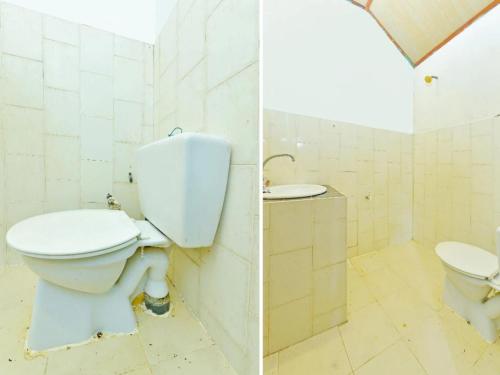 a bathroom with a toilet and a sink at Pelangi Beach Resort in Cherating