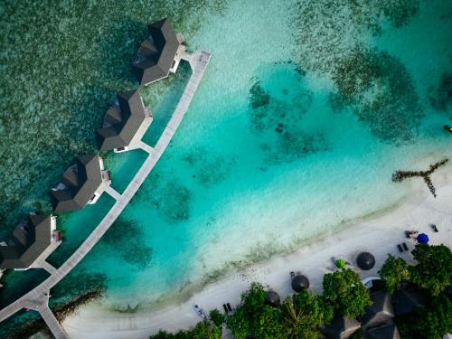 an aerial view of the beach at the excellence punta cana resort at Cinnamon Dhonveli Maldives in North Male Atoll