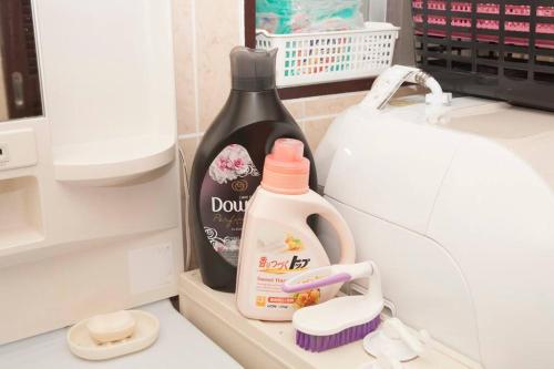 a bottle of dish detergent sitting in a refrigerator at 那覇市内を満喫したいあなたへ！大人数宿泊可！国際通りまで徒歩4分！無料駐車場1台＆Wifi完備！ in Makishimachi