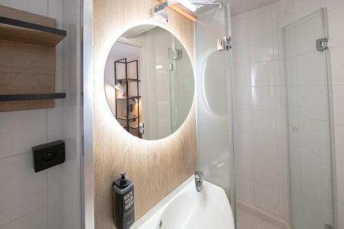 a bathroom with a sink and a mirror at ibis Avignon Centre Pont De L'Europe in Avignon