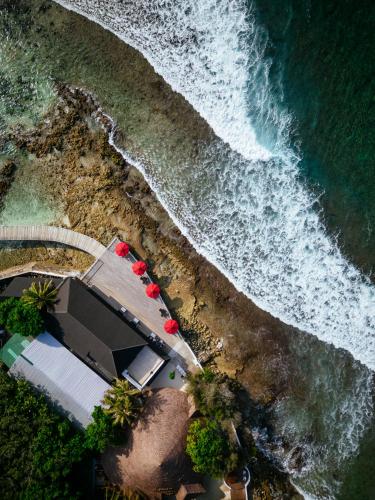 an overhead view of a beach with the ocean at Cinnamon Dhonveli Maldives in North Male Atoll