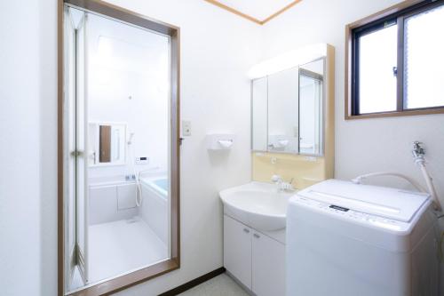 Kúpeľňa v ubytovaní 最大10人から25人まで宿泊可能三宮駅至近1フロア貸切コンドミニアム