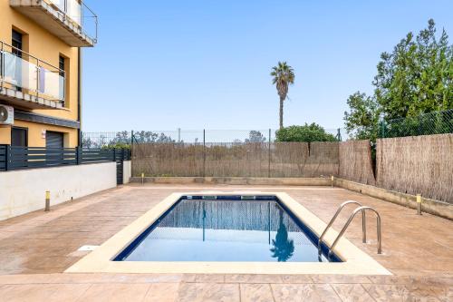 a swimming pool in the backyard of a house at Viudelta in Sant Jaume d'Enveja