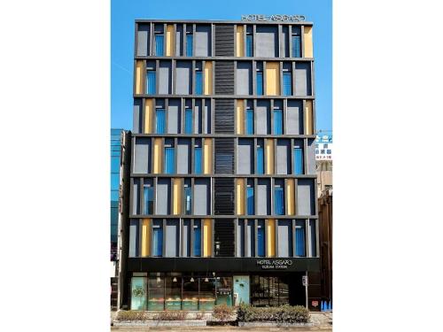 a tall building with many books on it at HOTEL ASGARD - Vacation STAY 80313v in Hirakata