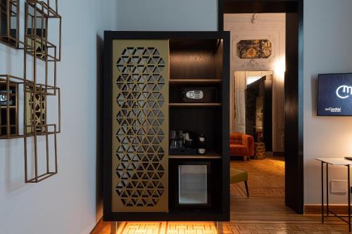 a room with a partition with a glass door at Boutique Hotel Cordial Malteses in Las Palmas de Gran Canaria