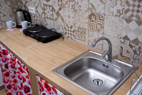 a kitchen counter with a sink and a bag on it at Anima Templi in Agrigento