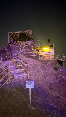 a set of stairs with a sign in front of it at Hatta Art Hub in Hatta