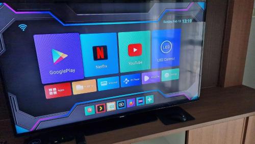 a television screen with a bunch of apps on it at Jacuzzi Pool Villa in Ban Huai Yai