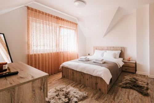 Giường trong phòng chung tại Villa Tina
