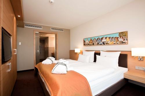 Säng eller sängar i ett rum på Atlantic Hotel Kiel