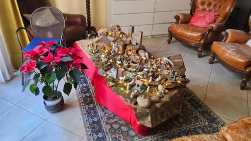 a table with a bunch of figurines on it at Verena Dependance Savoia & Campana in Montecatini Terme