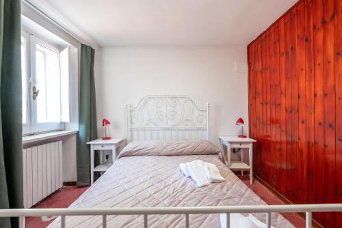 a bedroom with a large bed with two tables at La torretta sul cortile in Monteroduni