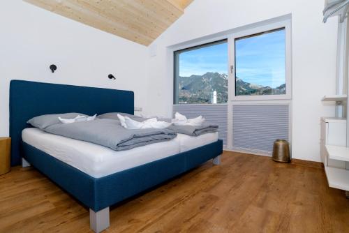 Postel nebo postele na pokoji v ubytování Berg Fux - Ferienwohnung Alfred der Büffel