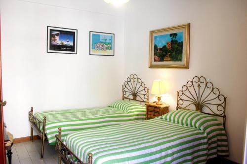 Appartamento Primula Rossa tesisinde bir odada yatak veya yataklar