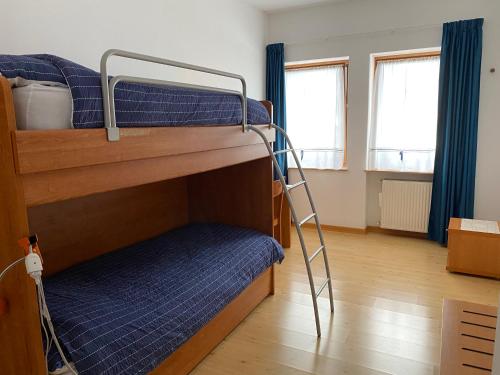 Postel nebo postele na pokoji v ubytování Garní Ladinia