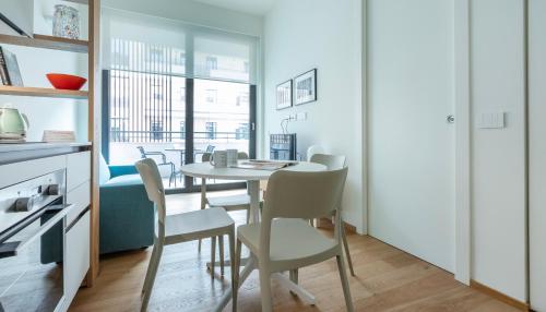 a kitchen and dining room with a table and chairs at Italianway - Cecchi 18 B in Milan