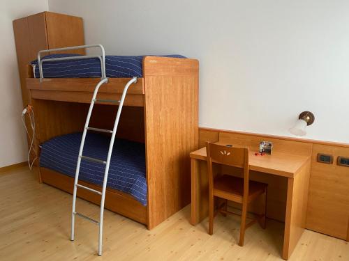 Postel nebo postele na pokoji v ubytování Garní Ladinia