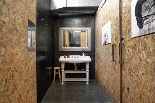 a bathroom with a sink and a mirror at THE LOFT - with private pool in Corbera de Llobregat