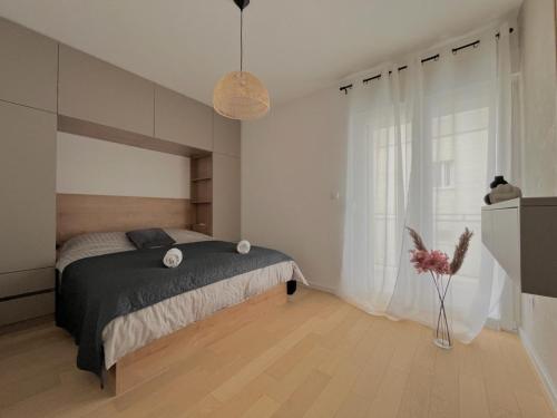 a bedroom with a bed and a large window at Premium Suite Anemar in Zadar