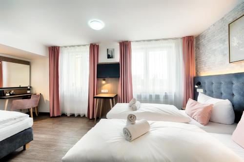 Кровать или кровати в номере Home Hotel