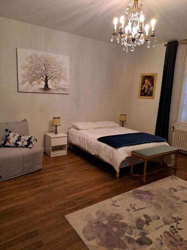Ένα ή περισσότερα κρεβάτια σε δωμάτιο στο La Dauversière 1