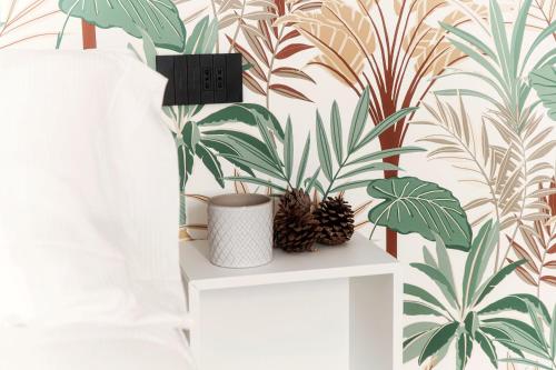 a room with a white table with plants on a wall at La casa di Piera in Como