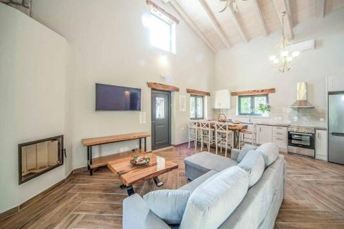 a living room with a couch and a table at Villa Dias in Agios Ioannis