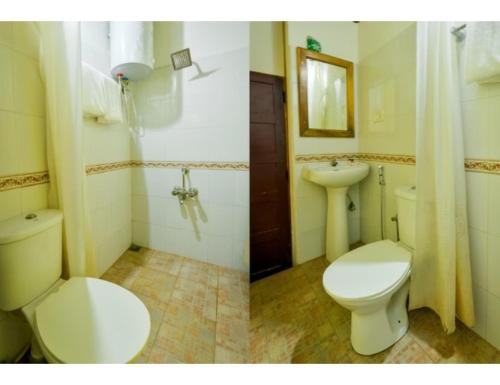 a bathroom with a toilet and a sink at R K Habbana Beach Resort, Baga, Goa in Baga