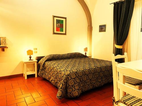 Кровать или кровати в номере Hotel Residence La Contessina