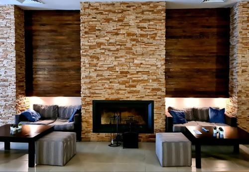 a living room with a couch and a fireplace at Aspen studio Mountain retreat at Aspen Resort Golf Ski & Spa in Razlog