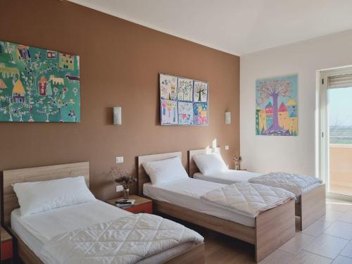 a room with three beds in a room at Agri B&B Terre Joniche in Isola Capo Rizzuto
