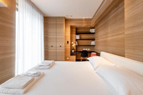 a bedroom with two beds and a window at Milan Royal Suites - Centro in Milan