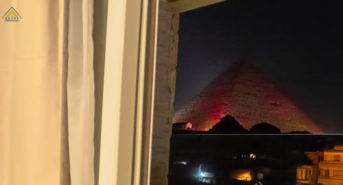 a view of the egyptian pyramid at night at Egypt Pyramids Inn in Cairo