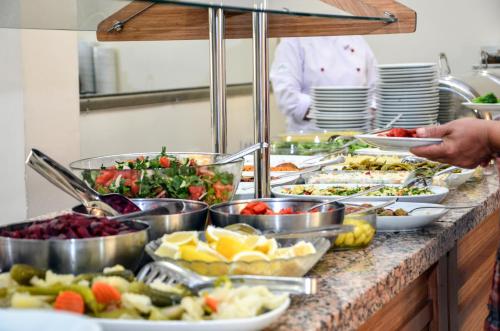 a buffet line with many different types of food at Perla Hotel in Dikili