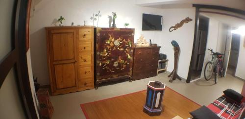 a living room with a dresser and a room with at Anthony in Agde