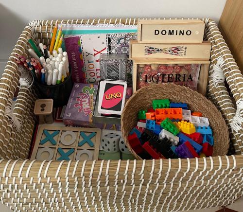 a basket filled with toys and office supplies at Apartamento PC in Torrelavega